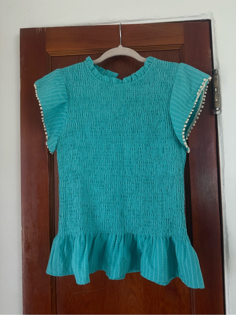 THML Teal Smocked Ruffle Sleeve Blouse with Pom Trim